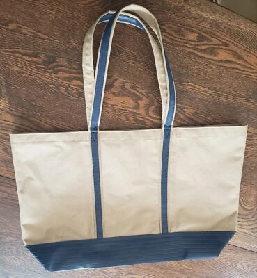 Bolso de viaje redondo vintage Avon de lona beige/azul para barco y bolso Foto 1 de 4