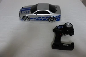 Coche de deriva Fast & Furious 1:10 RC Brian's Nissan Skyline GT-R R34 escala 1/10 Jada - Imagen 1 de 8