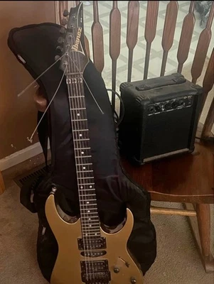 Guitarra Eléctrica Ibanez RG RG570 Dorada Metálica con Estuche Blando de Japón Foto 1 de 2