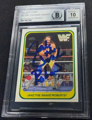 JAKE THE SNAKE ROBERTS SIGNED 1991 MERLIN WWF #82 BECKETT AUTO GRADE 10 909 - Image 1 of 2
