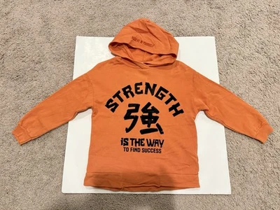 Sudadera con capucha Zara para niños talla 6y naranja cree en tu fuerza Foto 1 de 3