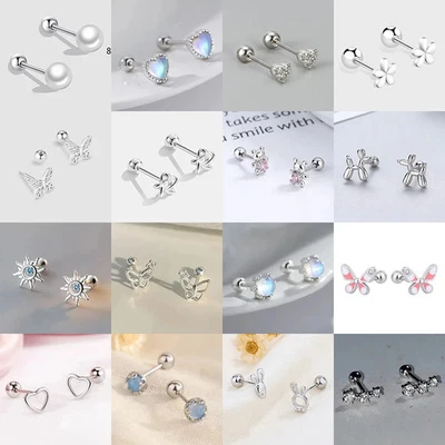 Aretes mariposa tono metal mujer huecos redondos pulidos joyería moderna Foto 1 de 4