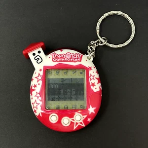 Tamagotchi Connection V5 (v5.5 Celebrity) Red White Stars 2004 Spanish Version - Picture 1 of 14