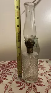 Old Oil Lamp clear glass on textured glass - Picture 1 of 7