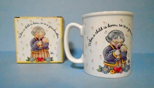 Taza de café Mary Engelbreit abuela cuando nace un niño también lo es una abuela - Imagen 1 de 4