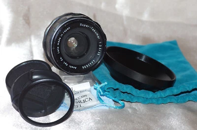 Objectif M42 35mm f3,5 SUPER TAKUMAR, bouchons, filtre, pare-soleil, housse TBE - Imagen 1 de 4