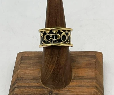 ANILLO BANDA ORO NEGRO FIRMA COACH TALLA 7 Foto 1 de 3