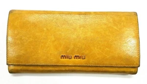 Auténtica billetera larga de cuero amarillo Miu para mujer usada - Imagen 1 de 12