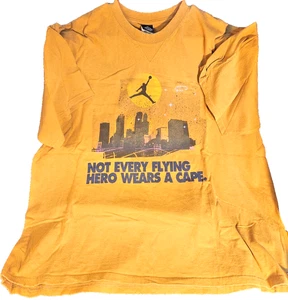 Jordan Jumpman Logo Over City Skyline "Not Every Flying Hero Wears A Cape" Shirt - Bild 1 von 6