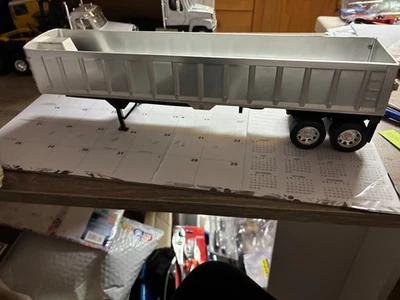 1/32 NEW RAY SILVER USED  FRAMELESS  END DUMP TRAILER, NO PACKAGING # B 743 - Image 1 of 4