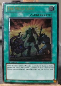 EIN HELD LEBT - GENF-DE098 Ultimate Rare / 1. Auflage NM E-HERO Elementar HELD - Bild 1 von 5