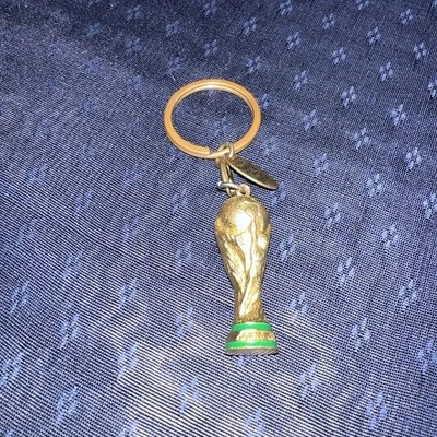 VINTAGE COCA COLA COLLECTIBLE KEYCHAIN Gold Tone FIFA Soccer 2009 - Image 1 of 4