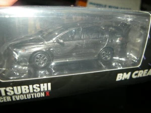 BMC Mitsubishi Lancer Evolution X gris/gris LHD en embalaje original 1:64 - Imagen 1 de 2