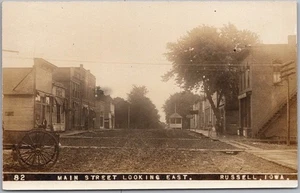 c1910s RUSSELL, Iowa Real Photo RPPC Postcard "MAIN STREET LOOKING EAST" Unused - Picture 1 of 2