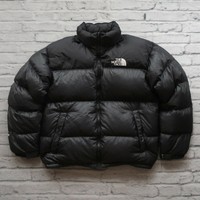 black puffy north face jacket