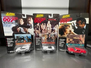 1/64 DIECAST JOHNNY LIGHTNING JAMES BOND 007 LOT OF 3 CARS LOTUS/TOYOTA/FORD NEW - Picture 1 of 5