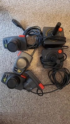 4 x Official Atari 2600 Controllers - 2 paddles (4) 2 Joysticks. untested/spares - Image 1 of 3