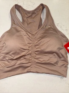 Puma Damen L nahtloser Sport-BH abnehmbare Cups hellbraun geringer Halt neu mit Etikett Large Fitnessstudio - Bild 1 von 6