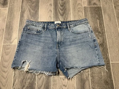 Pantalones cortos de mezclilla con montura para mujer talla 32 Le Grand Garcon desgastados tiro alto cortados Foto 1 de 4