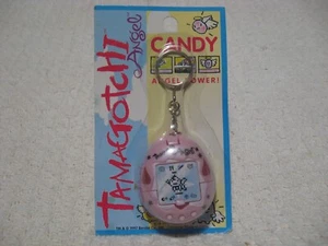 Vintage 90er 1997 Bandai Tamagotchi Engel Süßigkeiten Schlüsselanhänger virtuelles Haustier NEU! - Bild 1 von 5