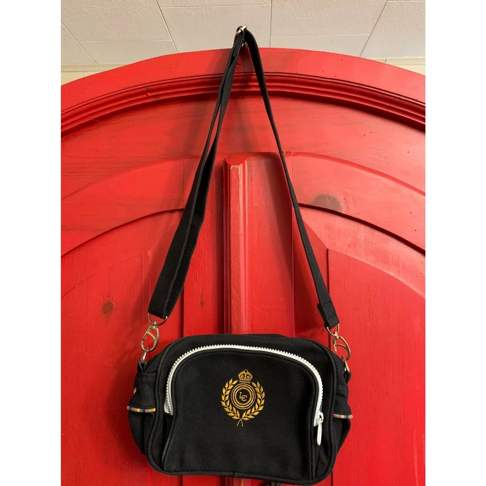 Riñonera cruzada bordada Liz Claiborne usada en excelente estado cartera ajustable negra Foto 1 de 4