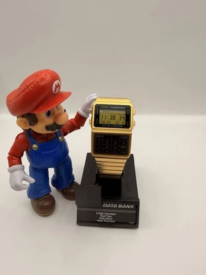 Reloj digital Casio DBC-611G-1D Databank calculadora tono dorado acero inoxidable Foto 1 de 4