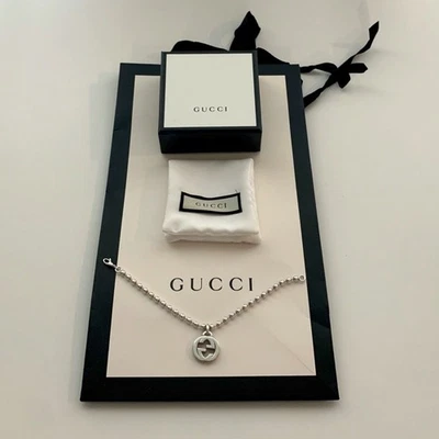 AUTHENTIC WOMANS GUCCI SILVER INTERLOCKING GG CHARM BRACELET - Image 1 of 4