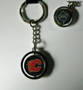 CALGARY FLAMMEN GUMMI PUCK SPINNER SCHLÜSSELANHÄNGER RING - Bild 1 von 1