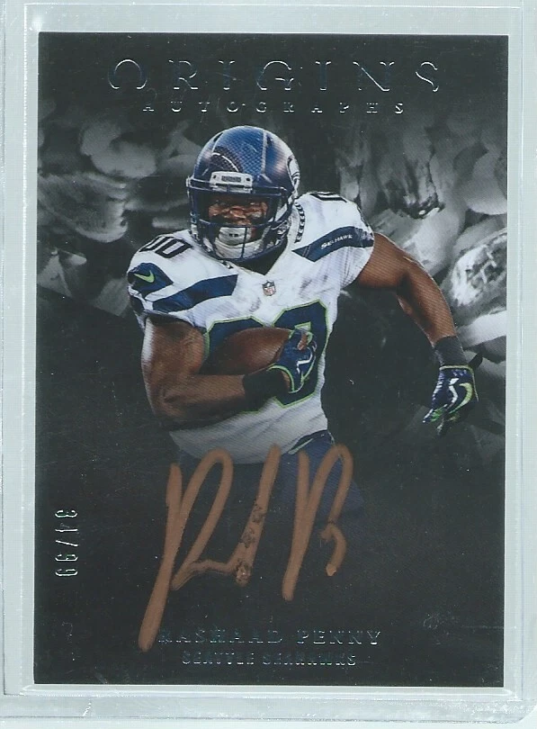 RASHAAD PENNY 2018 PANINI ORIGINS BLACK BRONZE INK ON-CARD AUTO RC #D 34/99 - Image 1 of 1