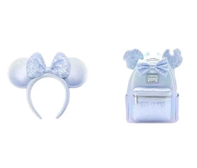 Mini Mochila LOUNGEFLY Azul Lentejuelas Iridiscentes Parques Disney 2025 y Orejas a Juego Foto 1 de 4