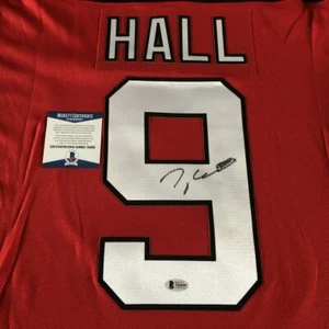 TAYLOR HALL SIGNED NEW JERSEY DEVILS #9 JERSEY w/EXACT PROOF & BECKETT BAS COA - Picture 1 of 4