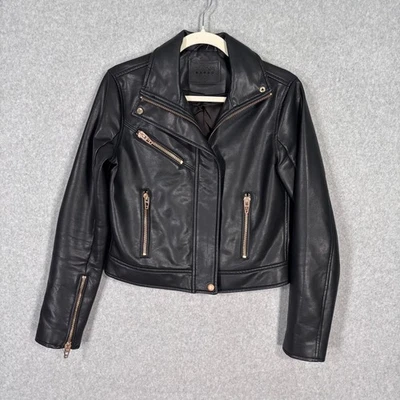 Chaqueta corta de moto de cuero sintético en blanco de Nueva York pequeña cremalleras doradas rosa sleaze años 90 punk Foto 1 de 4