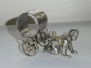 ANTIQUE VICTORIAN FIGURAL SILVER PLATE NAPKIN RING BOY ON KNEES PULLING CART - Picture 1 of 14