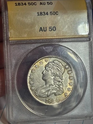 Бюст 1834 половина 50c ANACS AU50 тонированный #4963855 - Изображение 1 из 4
