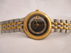 Reloj Gruen Tono Plata y Oro Banda de Acero Inoxidable Indicador de Fecha Cara Negra - Imagen 1 de 12