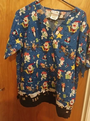WOMAN'S CHRISTMAS SCRUB TOP SHIRT BY UA SCRUBS SIZE LARGE - Image 1 of 3