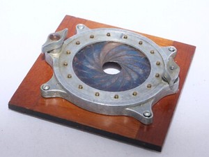 Universal Iris Lens Mounting Clamp. 58mm Size Opening. On a 4.5" board. Germany.