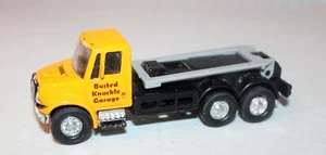 International Busted Knuckle Garage Tow Truck Yellow Showcasts 5.25" Diecast Car - Picture 1 of 4