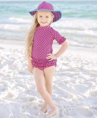 Conjunto de traje de baño con lunares rosa manga corta protector contra erupciones RuffleButts para niñas talla 6 Foto 1 de 4