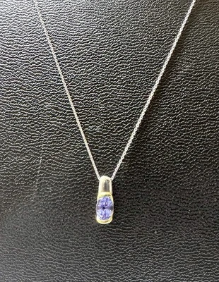 Collar colgante de tanzanita de 0,48 quilates de oro amarillo y platino de 18 quilates Foto 1 de 4