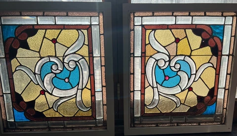 Matched pair of  stained and beveled stained glass windows. attributed to Mallon Cover