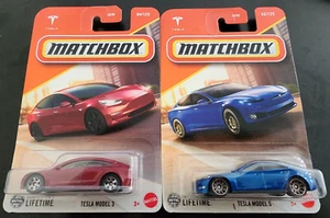 Matchbox 2025 Tesla Model 3 Maroon & Model S Blue 2 Diecast Cars Long Carded - Bild 1 von 6