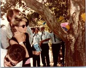1980s Crowd At Outdoor Event Woman With Sunglasses Holding Camera Vintage Photo - Picture 1 of 1