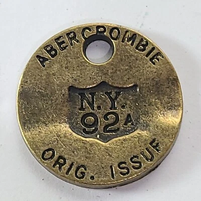 Abercrombie & Fitch 1892-1904 Vtg Brass Hang Ear Tag Jewelry Pendant Medallion - Image 1 of 4