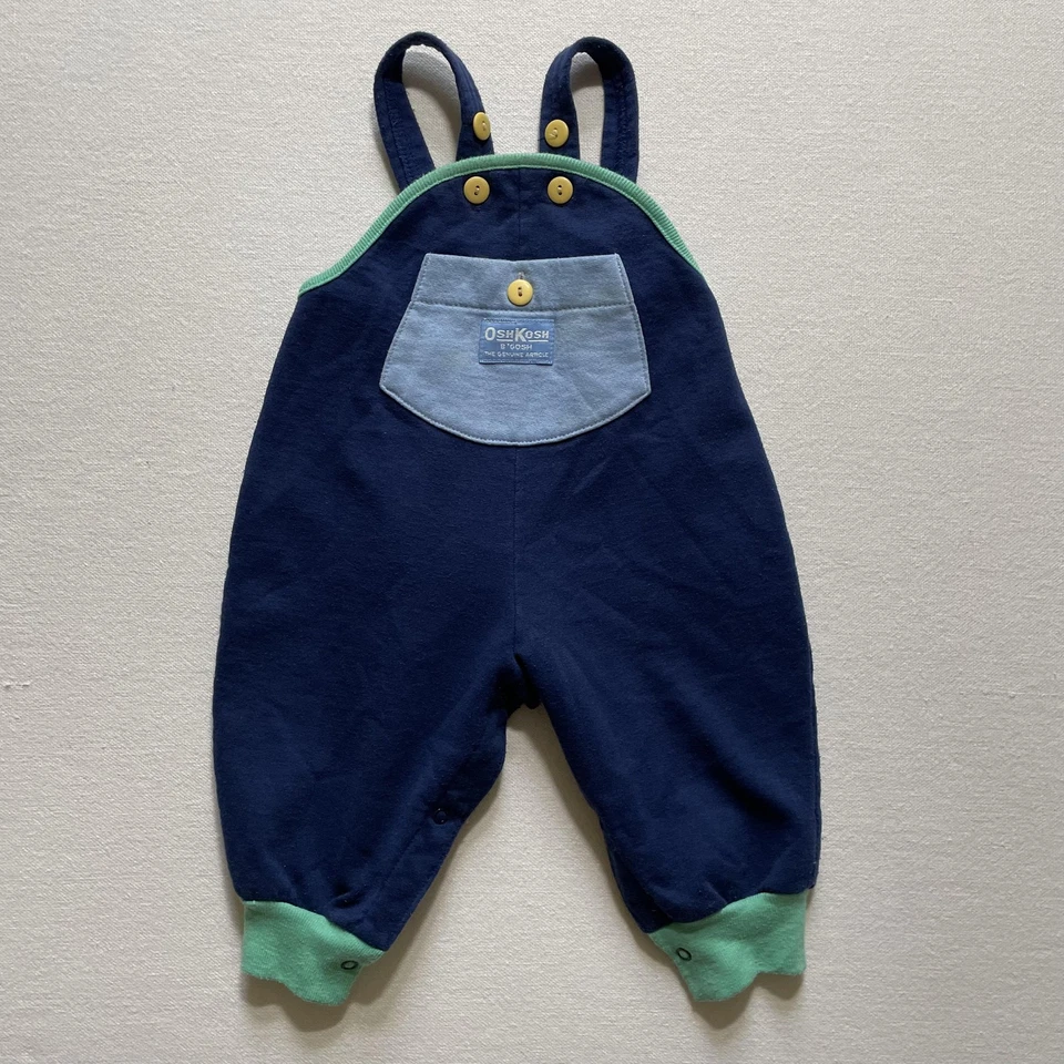 Mono vintage OshKosh B'gosh infantil 12 meses azul marino pierna a presión babero tejido años 90 Foto 1 de 4