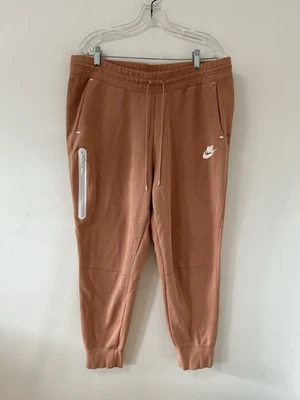 Pantalones de chándal Nike Tech polar para hombre grandes naranja melocotón cónicos Foto 1 de 4