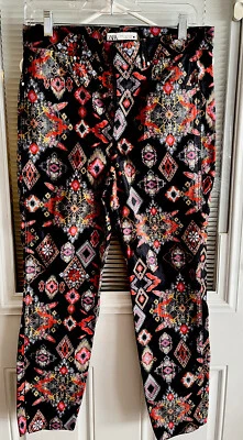 Pantalones de mezclilla Zara estampados frente plano multicolor negro naranja talla M usados en excelente estado Foto 1 de 4