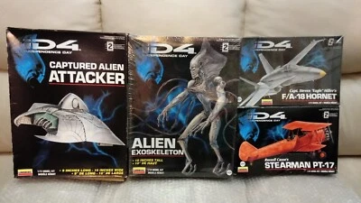 Four ID4 model kits: Captured Alien Attacker, Alien Exoskeleton, PT-17, F/A-18 - Image 1 of 4