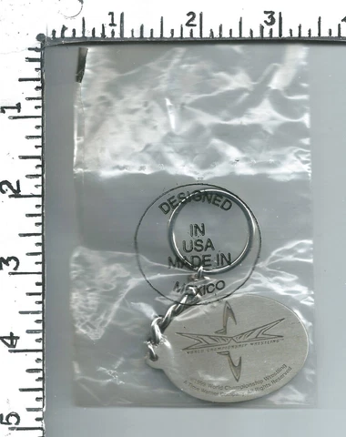 Two 1999 World Championship Wrestling key chain Cover