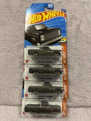Lote de 4 camionetas Chevy Silverado 2025 Hot Wheels 83 - grafito y oro - ¡buenas tarjetas! Foto 1 de 4